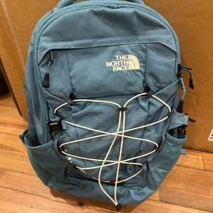 The North Face Teal Backpack with White Accents